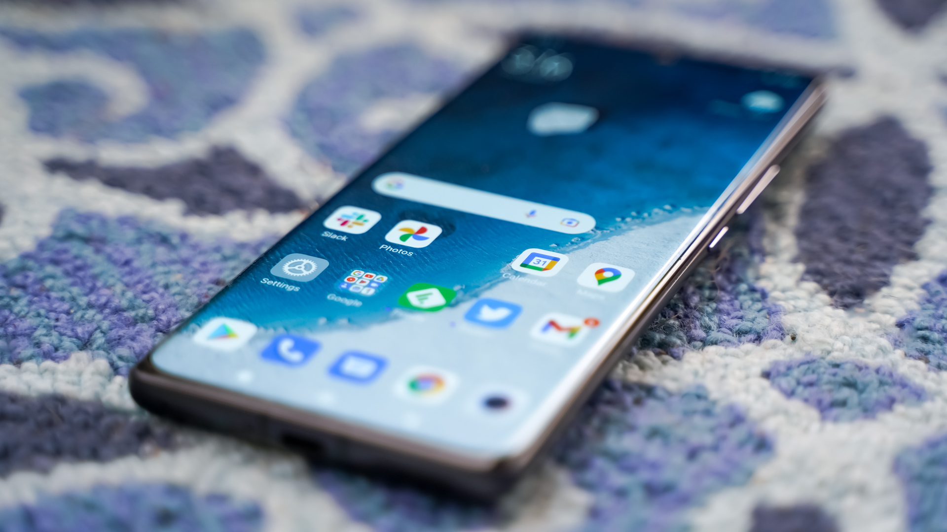 Xiaomi 12 Pro Steep angle on blue carpet Xiaomi 12 Pro showing screen angled on blue carpet