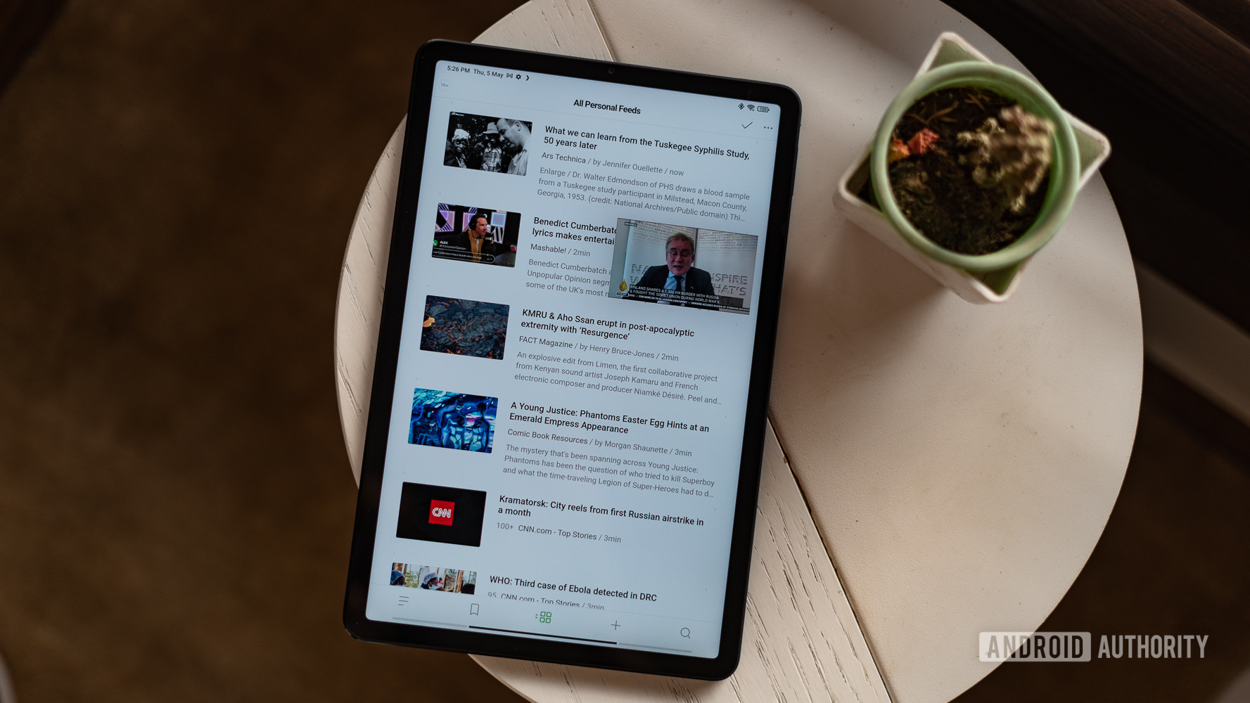Xiaomi Pad 5 top down view of a news feed and floating youtube